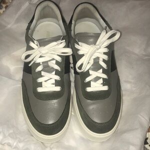 Axel Arigato designer leather low top sneaker size 10 color is dark green